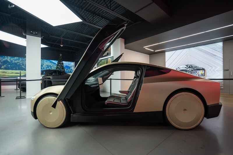 The Cybercab, a two-passenger battery-electric self-driving car under development by Tesla, is seen on display at a Tesla showroom in Bellevue, Washington.